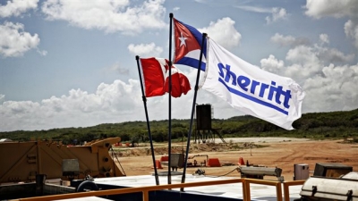 Bandera cubana, canadiense y Sherritt